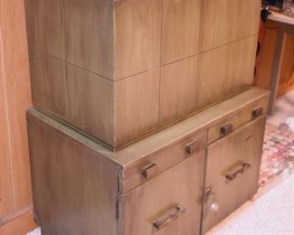 Item 46: Bar cabient $95 Weathered green midcentury brutalist bar cabinet has locking storage in the bottom. The top flips open to lift up a shelf with storage for differnt size drinkware. Even has small scale hydraulics to allow the shelf to sink back in gently and close softly. There's enough overall wear and damage from use that this will be a project.