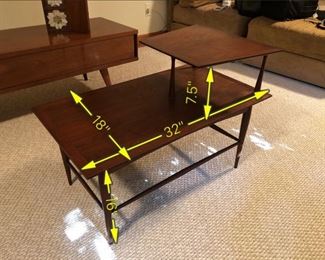 Item 50: Two-tier Rosewood End Table $70 Unmarked end table with particularly slim supports. Wood is in good condition, some minor water damage on surface.