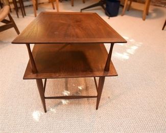 Item 50: Two-tier Rosewood End Table $70 Unmarked end table with particularly slim supports. Wood is in good condition, some minor water damage on surface.