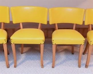 Item 51: PENDING Set of 4 Yellow Vinyl Chairs $160 Brilliant yellow vinyl, finished with nailheads at legs and on the back. All chairs have minor water damage at the bottom of legs. Overall good condition.