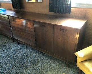 Item 60: American of Martinsville Double Dresser $185 Louvered drawer fronts, doors open to reveal more drawers. Fair condition. Deep marks on top surface, some dry spots.