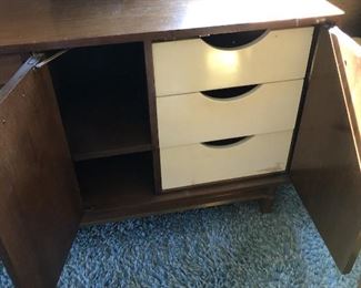 Item 60: American of Martinsville Double Dresser $185 Louvered drawer fronts, doors open to reveal more drawers. Fair condition. Deep marks on top surface, some dry spots.