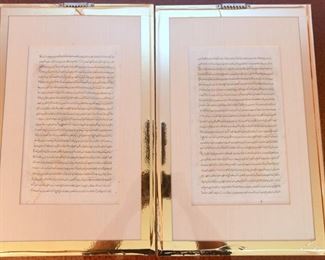 Item 70: Pair of Persian Illuminated Manuscript Pages $145 Both pages are sandwiched between glass so both sides are visible. Glass secured on back by gold foil tape. In the process of moving these to photograph, the foil tape on one has given up, so one of these will need to be resealed into its frame. Visible area is 11" x 7", outside dimensions of each frame: 18.5" x 12"