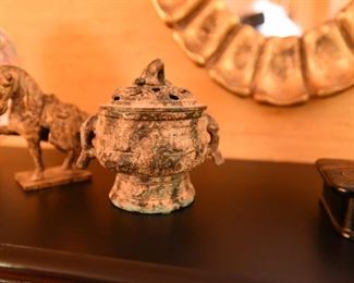 ITEM 73: Two Chinese Bronze Items $30 Small patinated cache pot and war horse.