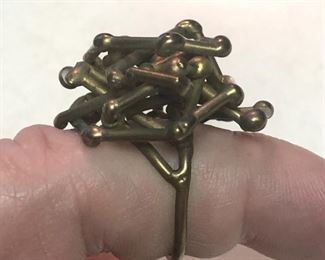 ITEM 86: Brass ring $22 Approximately size 7, this ring is comprised of a tangle of brass rods with bulbous ends.