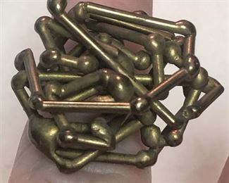 ITEM 86: Brass ring $22 Approximately size 7, this ring is comprised of a tangle of brass rods with bulbous ends.