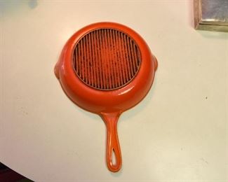ITEM 98: Orange enameled cast iron 9" skillet $20 Unmarked, likely made in Belgium.