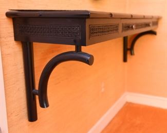 ITEM 115: Wall-mount black shelf $55 Faux bamboo trim, caned-look front panels. One drawer. Laminate on top is lifting on back left corner. Easily fixed with wood glue, a clamp, and 24 hours.