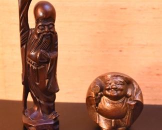 ITEM 118: Two Asian Figures $20 Carved rosewood figure; round brass Buddha