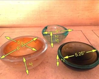 ITEM 120: Three Art Glass Bowls $55 L to R: Thick glass bowl with bubbles. The Interior has layers of orange glass and crackled gold encased in clear glass; green-brown shallow glass bowl; sea-green ribbed glass tri-form bowl.