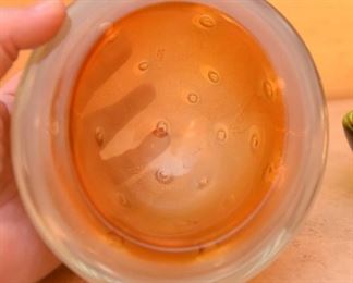 ITEM 120: Three Art Glass Bowls $55 L to R: Thick glass bowl with bubbles. The Interior has layers of orange glass and crackled gold encased in clear glass; green-brown shallow glass bowl; sea-green ribbed glass tri-form bowl.