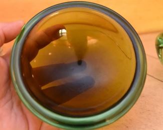 ITEM 120: Three Art Glass Bowls $55 L to R: Thick glass bowl with bubbles. The Interior has layers of orange glass and crackled gold encased in clear glass; green-brown shallow glass bowl; sea-green ribbed glass tri-form bowl.