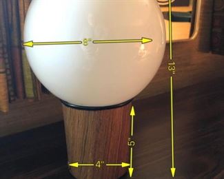 ITEM 127: MCM Globe Table Lamp $35 Teak-look laminate base. White glass globe. Inline switch.