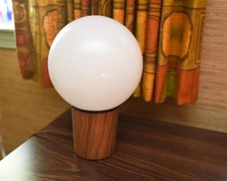 ITEM 127: MCM Globe Table Lamp $35 Teak-look laminate base. White glass globe. Inline switch.
