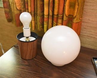 ITEM 127: MCM Globe Table Lamp $35 Teak-look laminate base. White glass globe. Inline switch.
