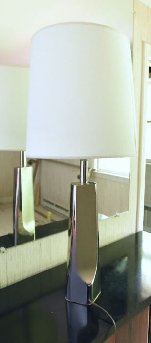 ITEM 128: Unmarked Chrome Lamp $25 Brushed and polished chrome contrast on this towering lamp. There is something on the chrome that does not come off with a damp cloth. Priced low so you feel better about taking a risk on this.