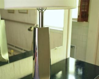 ITEM 128: Unmarked Chrome Lamp $25 Brushed and polished chrome contrast on this towering lamp. There is something on the chrome that does not come off with a damp cloth. Priced low so you feel better about taking a risk on this.