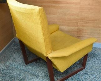 Item 17: Midcentury Lounge Chair & Foot Rest $425 Unmarked. Upholstered in yellow loose-weave fabric. The upholstery is soiled and has holes at wear points. Frame of both chair and foot rest are sound.