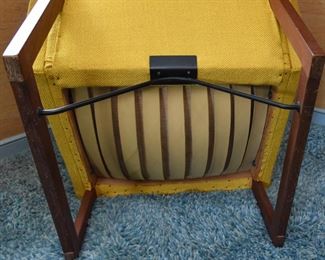 Item 17: Midcentury Lounge Chair & Foot Rest $425 Unmarked. Upholstered in yellow loose-weave fabric. The upholstery is soiled and has holes at wear points. Frame of both chair and foot rest are sound.