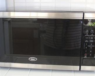#10 Oster microwave 11.5” height,  21”wide, 15” deep $40.00