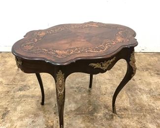 https://www.liveauctioneers.com/item/85207284_french-marquetry-inlaid-ormolu-turtle-top-table