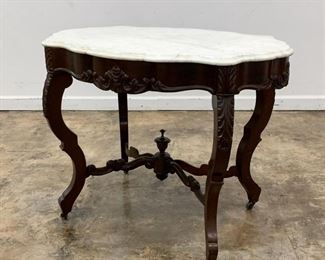 https://www.liveauctioneers.com/item/85207417_19th-c-mahogany-and-marble-turtle-top-parlor-table