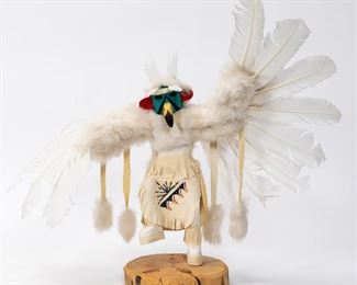 https://www.liveauctioneers.com/item/85207531_signed-white-eagle-kachina-doll-on-pine-stand
