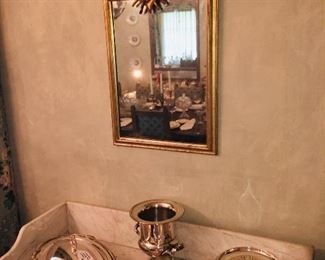 beautiful mirrors and many pieces of early Sheffield plate serving pieces