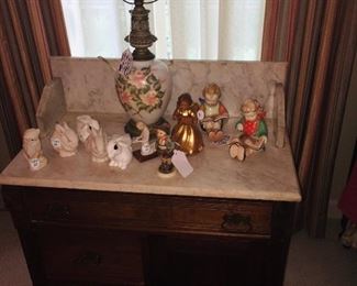 I love the marble top wash stand and its loaded with Cybis figurines of rabbits 