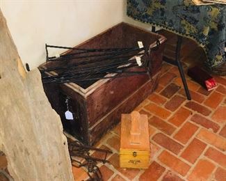 primitives such as old wooden crates, cross cut saws, drift wood,  hand made hooks and brackets