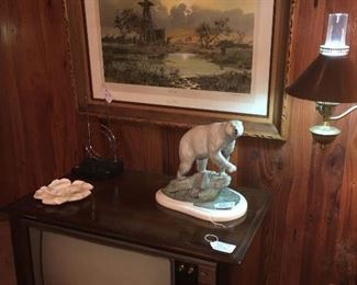 a working console RCA TV and a painted bronze of a polar bear by jack Putnam. 