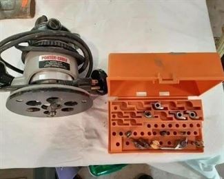 $44 - G134 - Porter Cable Router Model 1001 with 12 router bits & case.