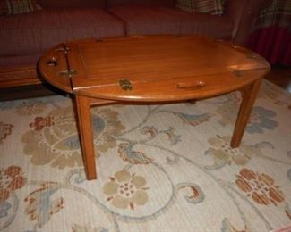 Vintage solid wood coffee table w/edges that hinge up https://ctbids.com/#!/description/share/409807