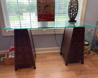 	#60	Desk with wooden base and glass top 50"x26"x30"	 $75.00 	