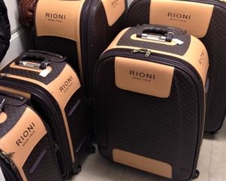NEW Rioni  luggage - The body is accented with Italian leather handles and trim.