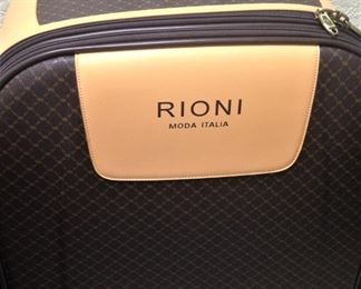 Rioni  luxurious luggage --- Italian leather trim --- six wheels for extra maneuverability