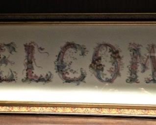 "Welcome" framed art