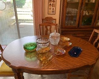 Oval dining room table with six chairs and one leaf. Lots of nice glassware