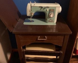 New Home sewing machine with cabinet and chair