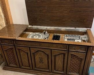 Console stereo, AM/FM radio, eight track, and turntable.