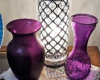 Purple glass and lighted lamp