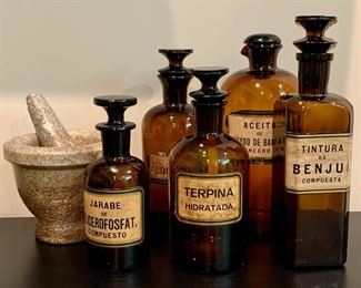 Item 201:  Set of (5) Amber Glass Apothecary Jars with Stoppers and stone mortar and pestle: $445
