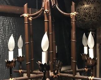 This item is a painted metal "faux bamboo" Hollywood Regency chandelier.  It has six lights.  It measures 22 1/2" wide and 23 1/2" long.  Price is: $350.00