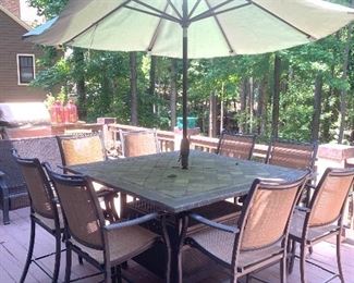 slate-top bistro height umbrella table with 8 chairs