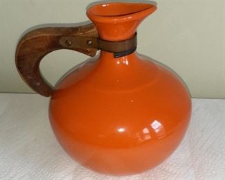 Lot 9: 
Bauer orange pitcher with wood handle 
