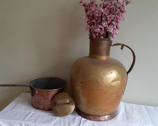Lot 11: $75
Antique Brass/ copper Country kitchen milk jug 
Heavy tin lined Copper pot ( has small crack on bottom) 
