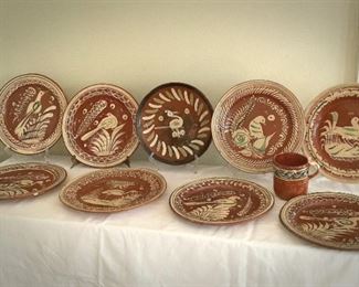 Lot 29:
(10) large vintage 1930/1940 red ware Mexican plates 
Mug