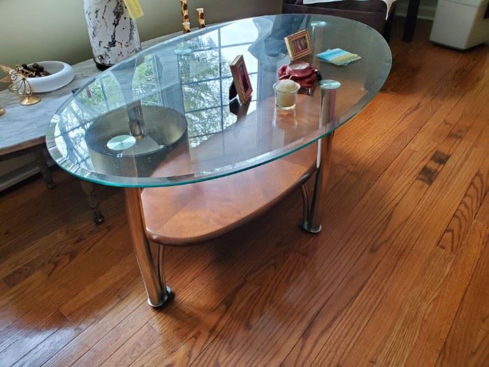 Glass, chrome and wood coffee table 46Lx28Wx18H, has matching end tables, $125