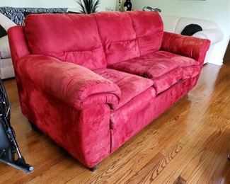 Red sofa 72Lx40Hx36D, has sun damage $75   