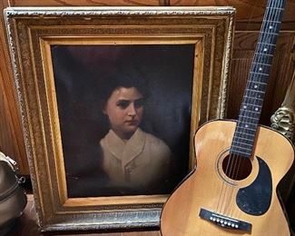 Old painted portrait and guitar